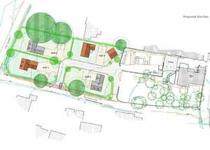 Site plan showing multiple buildings and landscaping with trees and pathways.