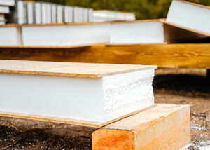 Close-up of stacked wooden boards, featuring smooth edges and a natural finish.
